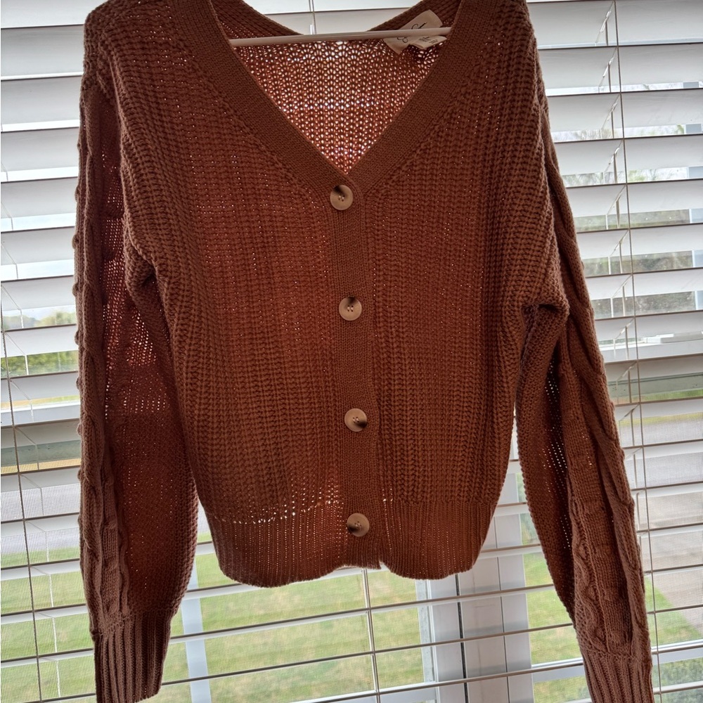Assortment of women’s medium sweaters and tops